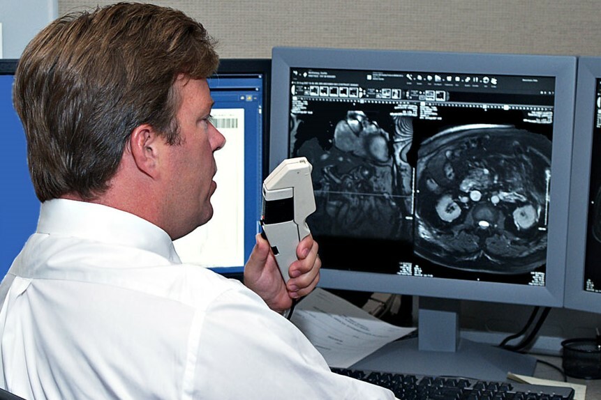 doctor with tool looking at images